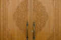 Tashkent, Uzbekistan. December 2020. Wooden carved doors of the White Mosque Minor