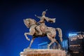 TASHKENT, UZBEKISTAN - MARCH 14, 2023: Monument Amir Timur or Tamerlane at nighttime against the backdrop of the hotel.