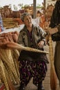 Tashkent, Uzbekistan - May 18, 2018 - Customer negotiates to purchase hand-made broom