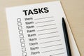 Task checklist with black pen on white paper background for efficient planning. concept of organization, task management Royalty Free Stock Photo