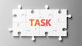Task complex like a puzzle - pictured as word Task on a puzzle pieces to show that Task can be difficult and needs cooperating