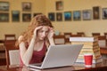 Task, test, learning and education concept. Intelligent, reader girl wearing casually sitting at desk in reading room in front of