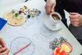 Tasseography: empty coffee cup, natal charts, runes and magic stones on table Royalty Free Stock Photo