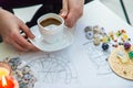 Tasseography: empty coffee cup, natal charts, runes and magic stones on table Royalty Free Stock Photo