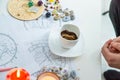 Tasseography: empty coffee cup, natal charts, runes and magic stones on table Royalty Free Stock Photo