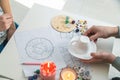 Tasseography: empty coffee cup, natal charts, runes and magic stones on table Royalty Free Stock Photo
