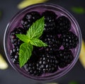 Taste of forest with gin based cocktail with blackberry liqueur and berries. Selective focus