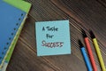 A Taste For Success write on sticky notes isolated on Wooden Table