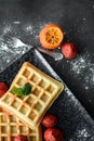 Tasteful Belgian waffles and dried strawberries for breakfast