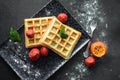 Tasteful Belgian waffles and dried strawberries for breakfast