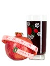 Tasteful fruit garnet with measuring tape Royalty Free Stock Photo