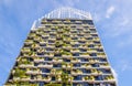 A tastefully contemporary green facade of a multi-storey building