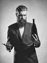 Taster of wine. Bearded man with wine bottle