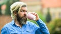 Tastes delicious. good morning inspiration. brutal man with beard drinking tea from cup. bearded man drink coffee