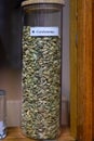 Tastes of gin, botanicals ingredients for gin distillery process, name in Spaniish translated into English: cardamom, dried