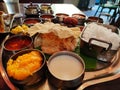 Tastey yummy south Indian lunch thali with variety of dishesh and sweet kesari curd rice parrota aplam papad lunch