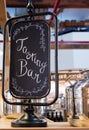 Tasting bar sign with shiny stainless steel pot Royalty Free Stock Photo