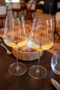 Tasting of Bordeaux white wine in Sauternes, left bank of Gironde Estuary, France. Glasses of white sweet French wine