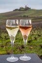 Tasting of brut and rose champagne sparkling wine outdoor with view on pinot noir gran cru vineyards of famous champagne houses in Royalty Free Stock Photo