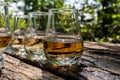 Tasting of different Scotch whiskies on outdoor terrace, dram of whiskey