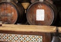 Tasting of different sweet wines from wooden barrels on old bodega in central part of Malaga, Andalusia, Spain