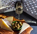 Tasting of fortified Andalusian dry and sweet sherry wine with traditional Spanisch tapas, green olives, goat and sheep manchego Royalty Free Stock Photo