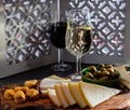 Tasting of fortified Andalusian sherry wine with traditional Spanisch tapas, green olives, goat and sheep manchego cheese Royalty Free Stock Photo