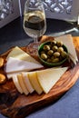 Tasting of fortified Andalusian sherry wine with traditional Spanisch tapas, green olives, goat and sheep manchego cheese Royalty Free Stock Photo