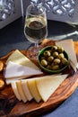 Tasting of fortified Andalusian sherry wine with traditional Spanisch tapas, green olives, goat and sheep manchego cheese Royalty Free Stock Photo