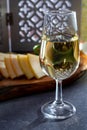 Tasting of fortified Andalusian sherry wine with traditional Spanisch tapas, green olives, goat and sheep manchego cheese Royalty Free Stock Photo