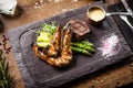 Tasting menu. Beef steak and grilled tiger prawns. Royalty Free Stock Photo