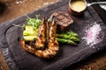 Tasting menu. Beef steak and grilled tiger prawns. Royalty Free Stock Photo