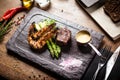 Tasting menu. Beef steak and grilled tiger prawns. Royalty Free Stock Photo