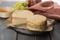 Tasting of oldest french AOC soft pudgent yellow cheese Livarot Royalty Free Stock Photo