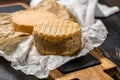 Tasting of oldest french AOC soft pudgent yellow cheese Livarot Royalty Free Stock Photo