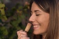 Young woman smelling red wine cork. tasting wine Royalty Free Stock Photo