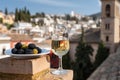 Tasting of Spanish sweet and dry fortified Vino de Jerez sherry wine and olives with view on roofs and houses of old andalusian Royalty Free Stock Photo