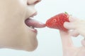 tasting strawberry Royalty Free Stock Photo