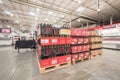 Tasting table near variety of wine and champagne stacks at Costco Wholesale store in USA