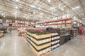 Tasting table near variety of wine and champagne stacks at Costco Wholesale store in USA