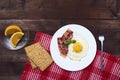 Tastu fried egg in plate with bacon Royalty Free Stock Photo