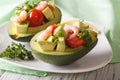 Tasty appetizer of avocado and shrimp salad close-up. horizontal Royalty Free Stock Photo