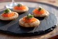Tasty appetizer for dinner, small pancakes bliny with red fish caviar