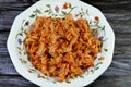 tasty appetizing classic pasta fusilli macaroni plate with tomato sauce, garlic, onion, spices, oil and black pepper, selective Royalty Free Stock Photo