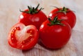 Tasty appetizing tomatoes on a wooden surface