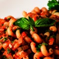 Traditional italian pasta with tomato sauce and basil on the top. Homemade Marinara sauce with Cavatappi pasta. Closeup Royalty Free Stock Photo