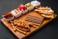 Tasty Assorted Dips on wooden tray