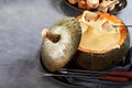 Tasty autumn cheese fondue in a hollowed pumpkin