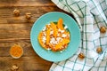 Tasty autumn pumpkin salad with cheese on rustic background. Beautiful fall colors