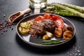 Tasty baked beef medallion with vegetables, mushrooms and spices Royalty Free Stock Photo